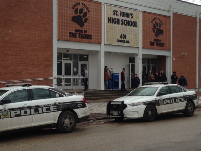 Two police cruisers sit outside St. John's High School after a serious assault according to Winnipeg police.