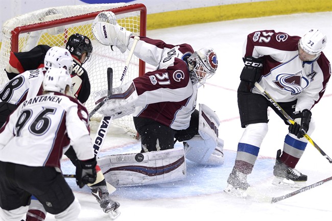 Colorado Avalanche goalie Calvin Pickard (31) makes a save against the Ottawa Senators during third period NHL hockey action in Ottawa, Thursday, March 2, 2017.