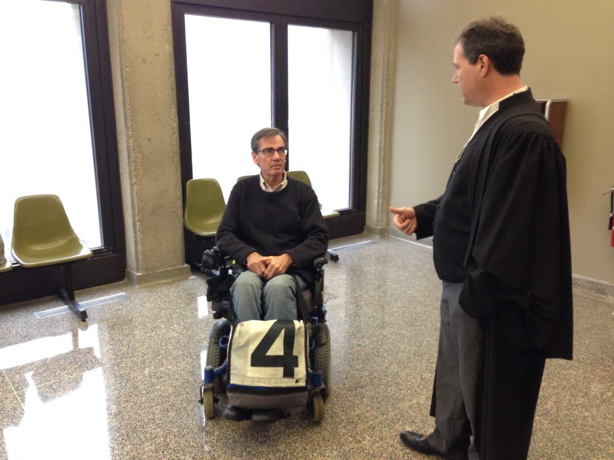Gerry Post (left) speaks with lawyer David Fraser in Halifax on March 1, 2017.