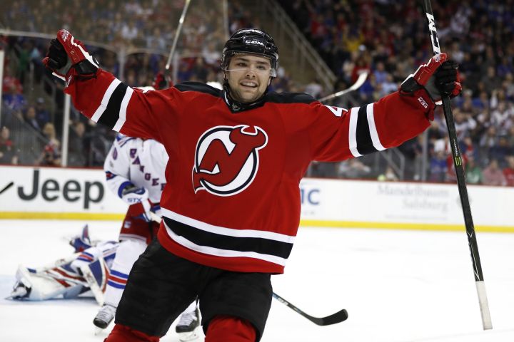 New Jersey Devils center John Quenneville celebrates after scoring his first NHL goal during the second period of an NHL hockey game against the New York Rangers, Tuesday, March 21, 2017, in Newark, N.J. (AP Photo/Julio Cortez).