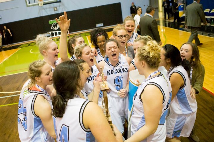 The Lethbridge Kodiaks Women's Basketball team celebrates an ACAC title win.