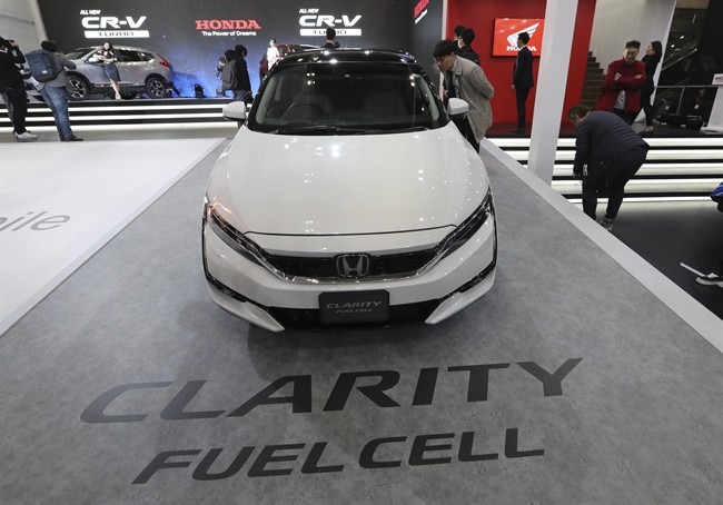 A man looks at Honda's Clarity Fuel Cell vehicle at the 2017 Seoul Motor Show in Goyang, South Korea in March.