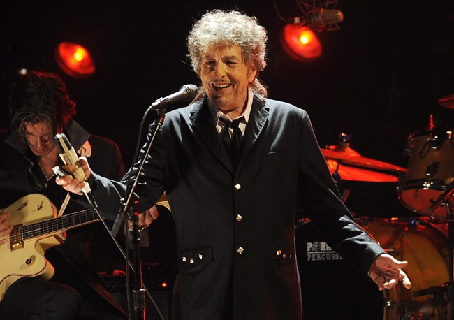 In this Jan. 12, 2012, file photo, Bob Dylan performs in Los Angeles. The Swedish Academy says 2016 Nobel literature winner Bob Dylan will meet with members of the academy this weekend and they will hand over his Nobel diploma and medal. 