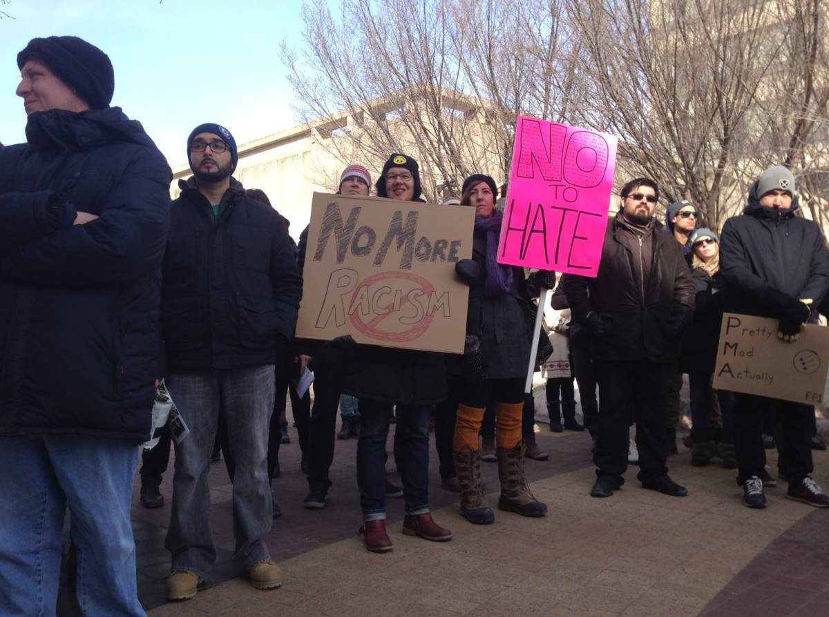 People gather outside Toronto City Hall to stand behind M-103, a motion to condemn Islamophobia.