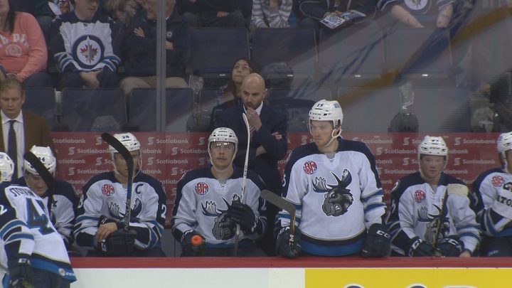 Manitoba Moose head coach Pascal Vincent patrols the bench.