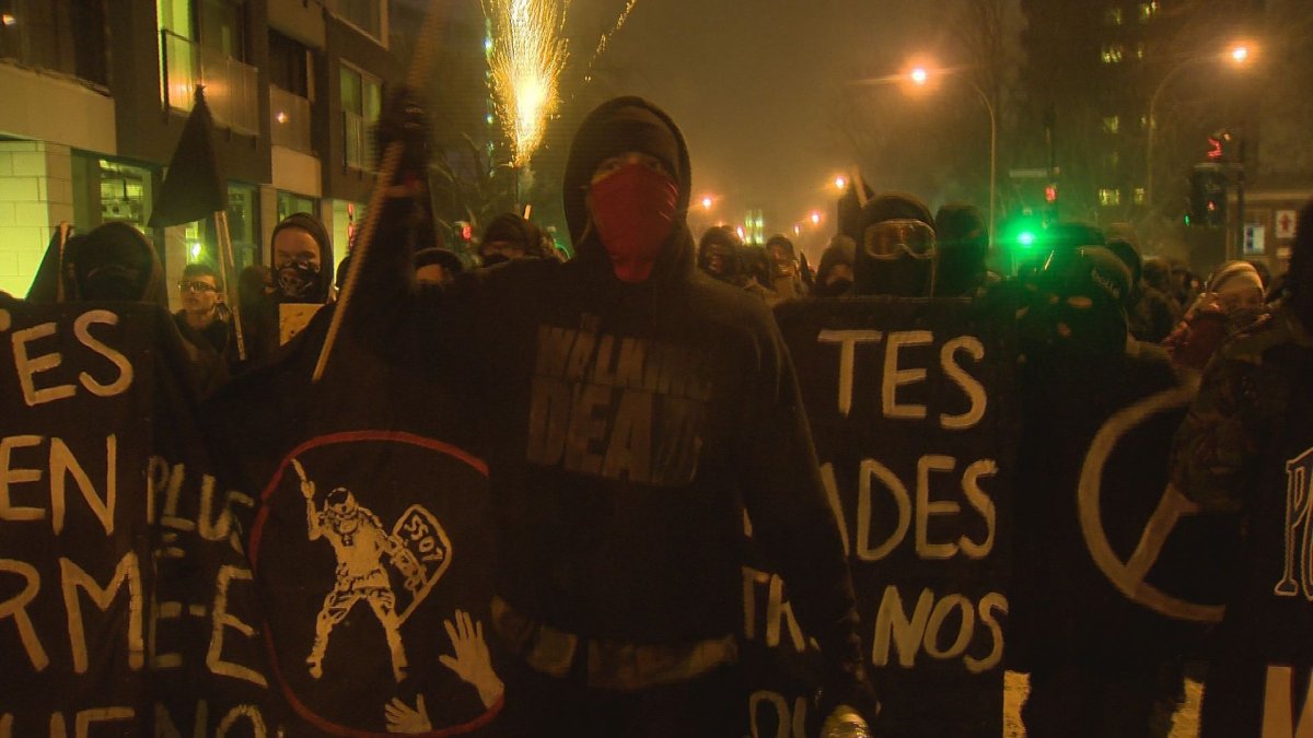 Protesters march in the annual against police brutality demonstration in Montreal, Wednesday, March 15, 2017.