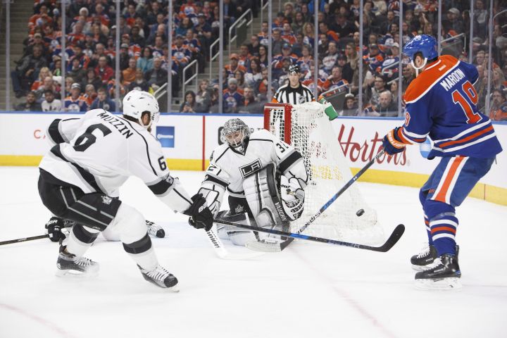 Edmonton Oilers' Patrick Maroon (19) can't get a shot past Los Angeles Kings goaltender Jonathan Quick (32) as Jake Muzzin (6) defends during second period NHL action in Edmonton, Alta., on Monday, March 20, 2017. 