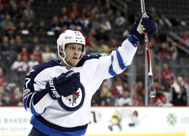 Winnipeg Jets left wing Nikolaj Ehlers, of Denmark, celebrates after scoring a goal on the New Jersey Devils during the first period of an NHL game, Tuesday, March 28, 2017, in Newark, N.J. 