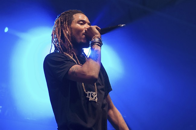 In this Saturday, Dec. 26, 2015, file photo, Rapper Fetty Wap performs in concert at Pier 36 in New York City.