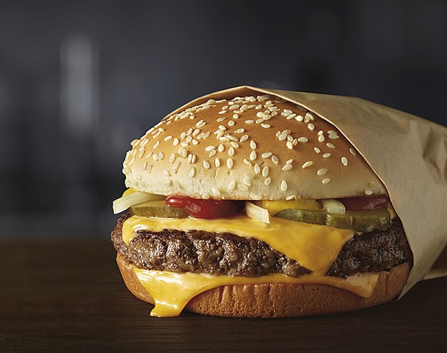 This image provided by McDonald‚Äôs Corporation shows a Quarter Pounder burger. 