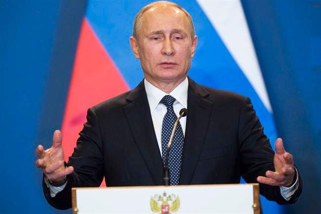 In this Feb. 2, 2017 file photo, Russian President Vladimir Putin speaks during a news conference at the parliament building in Budapest, Hungary.