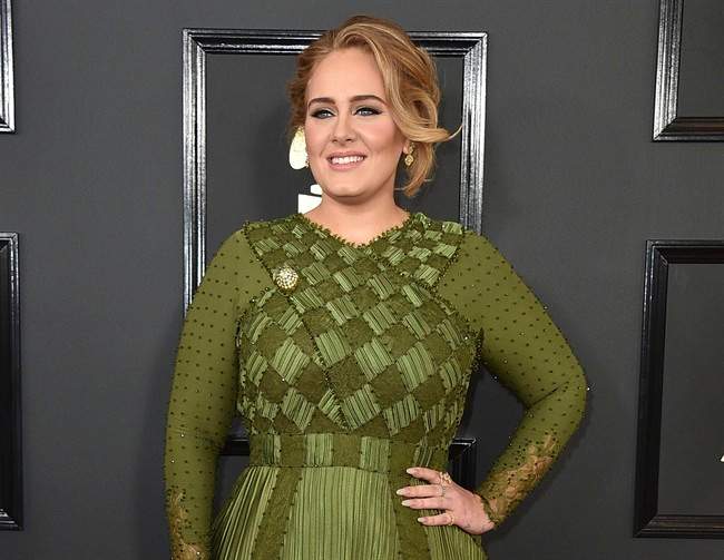 FILE - In this Feb. 12, 2017 file photo, Adele arrives at the 59th annual Grammy Awards in Los Angeles. 