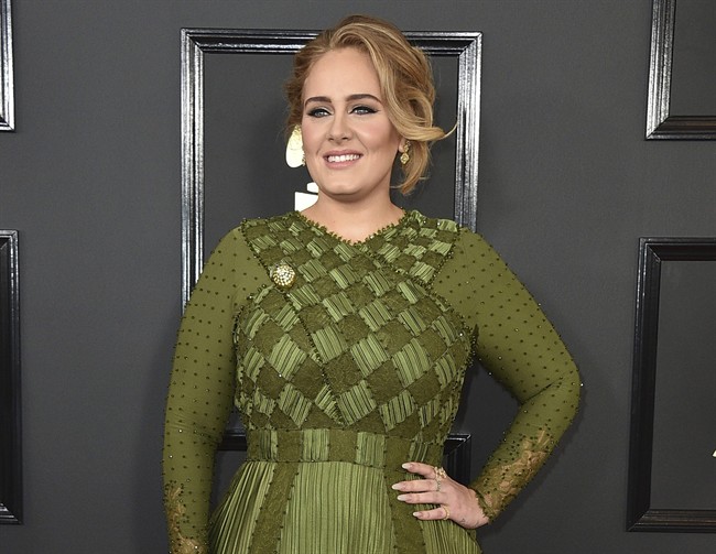 FILE - In this Feb. 12, 2017 file photo, Adele arrives at the 59th annual Grammy Awards in Los Angeles. 
