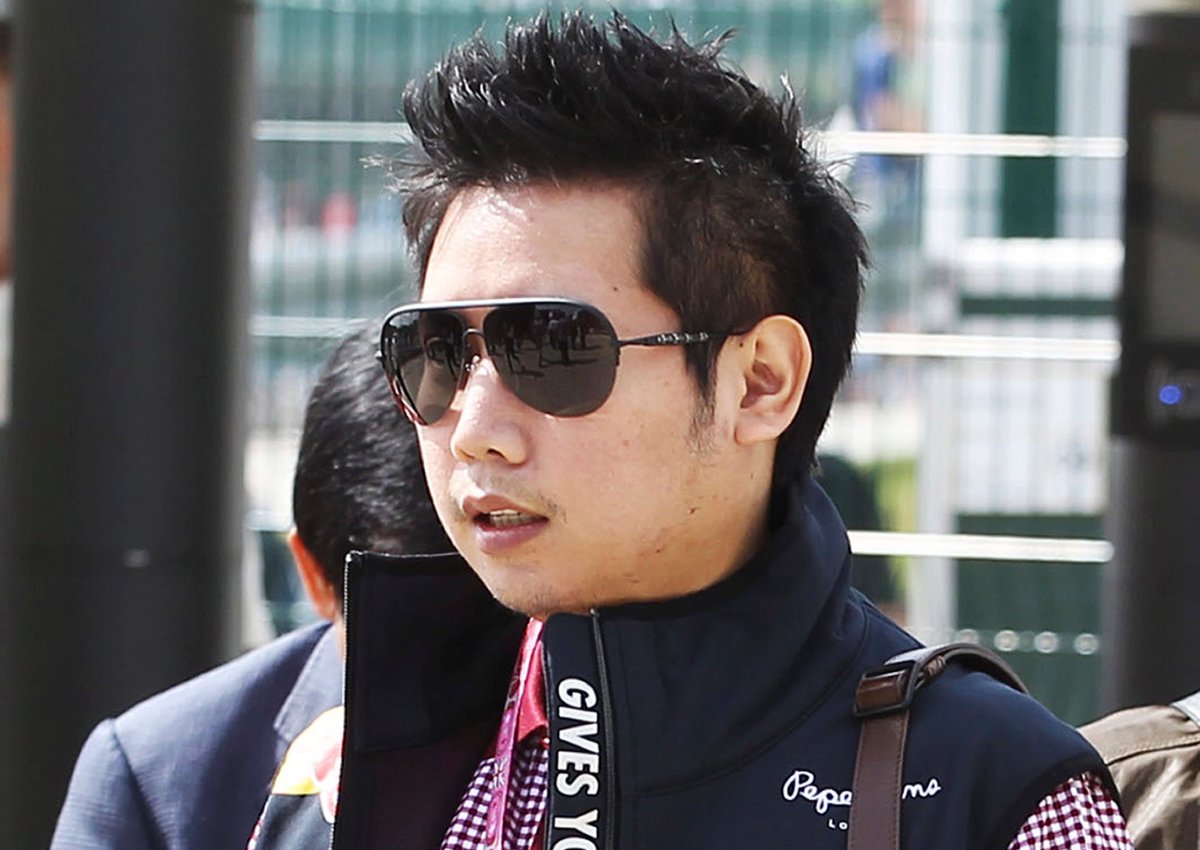 In this June 30, 2013, photo provided by XPB Images, Vorayuth "Boss" Yoovidhya walks at the British Formula 1 Grand Prix in Silverstone, England.