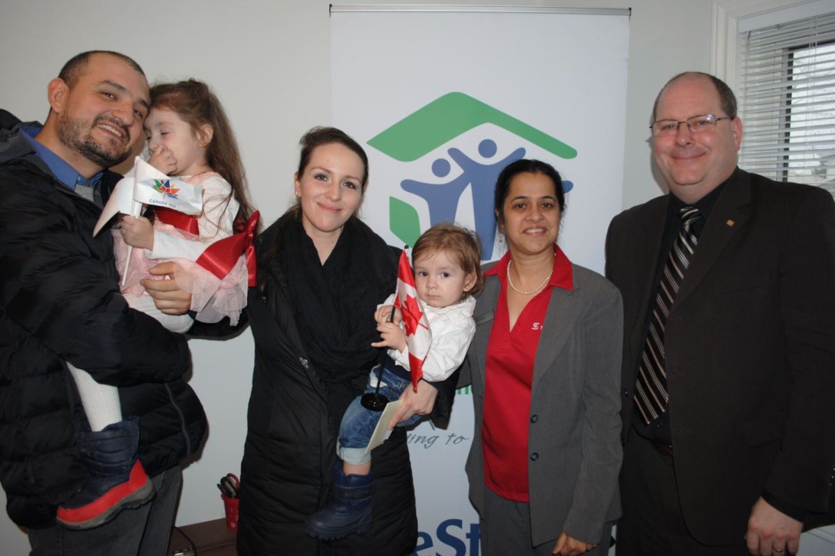Robitaille family stands with Scotiabank house sponsors.