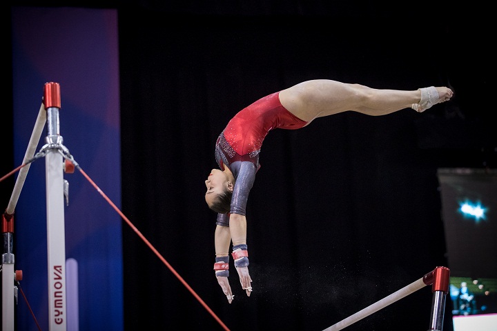 Canadian Rose Woo performs on the uneven bars at the Gymnix International competition in Montreal on Friday, March 10, 2017.