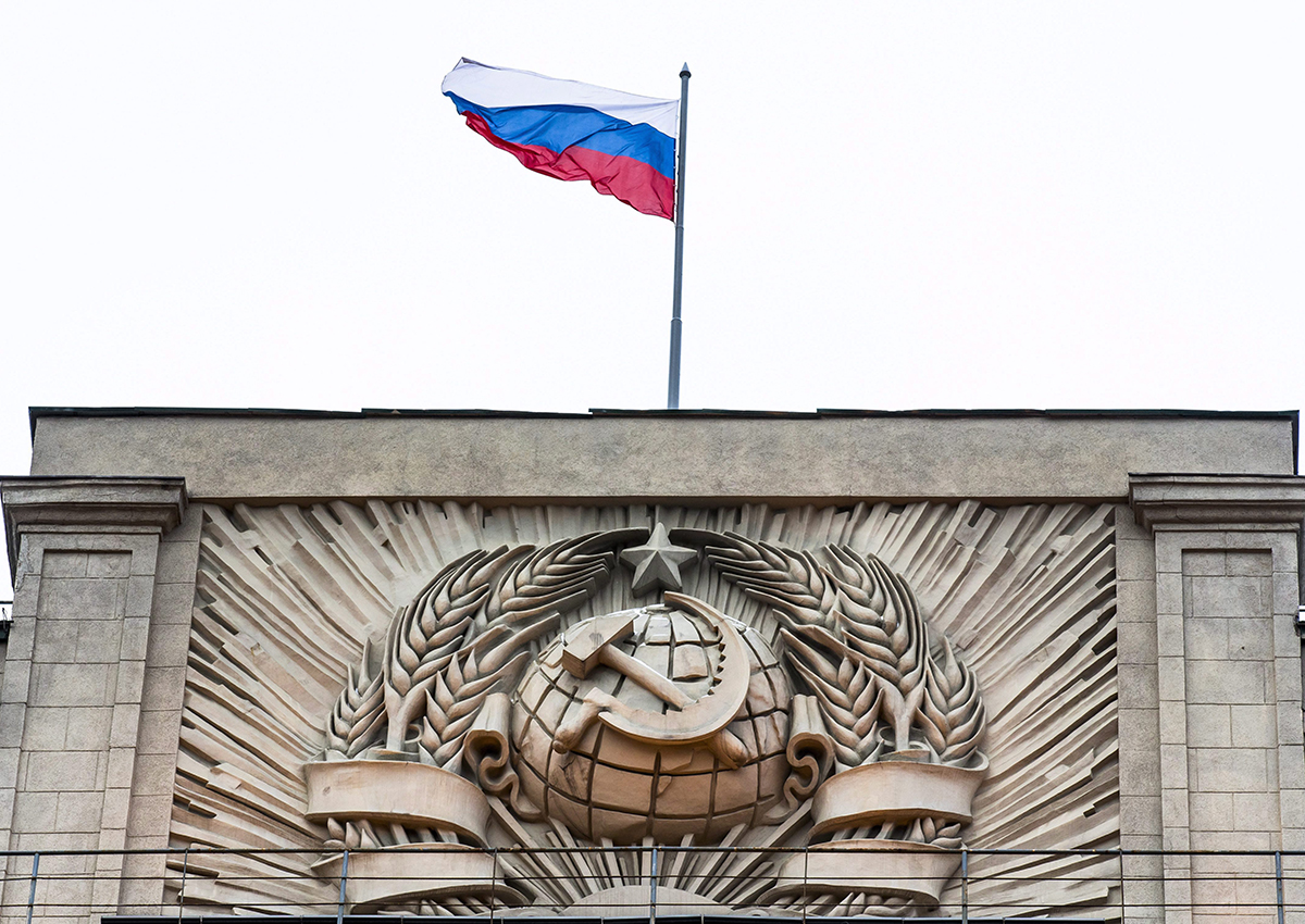 A Russian state flag waves on top of a hummer and sickle at the State Duma, lower parliament chamber, headquarters in Moscow, Russia, Tuesday, Feb. 14, 2017. 