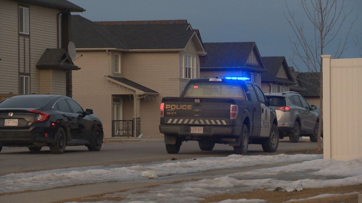 Calgary police officers were on scene Friday in Saddle Ridge. 