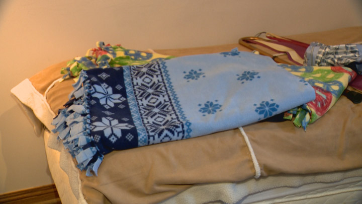 Religious communities in Saskatoon make fleece blankets for asylum seekers fleeing into Canada.