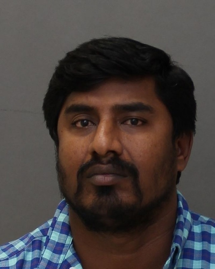 Murali Muthyalu was arrested Wednesday and charged with extortion, fraud over $5,000 and pretending to practice witchcraft.