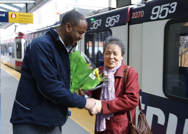 Li Feng Yang thanks CTrain operator Mesfin Tadese at the Centre street CTrain station in Calgary, Tuesday, March 28, 2017. Tadese found the 75-year-old Yang's purse containing $1,300 on a train and had it returned to her.