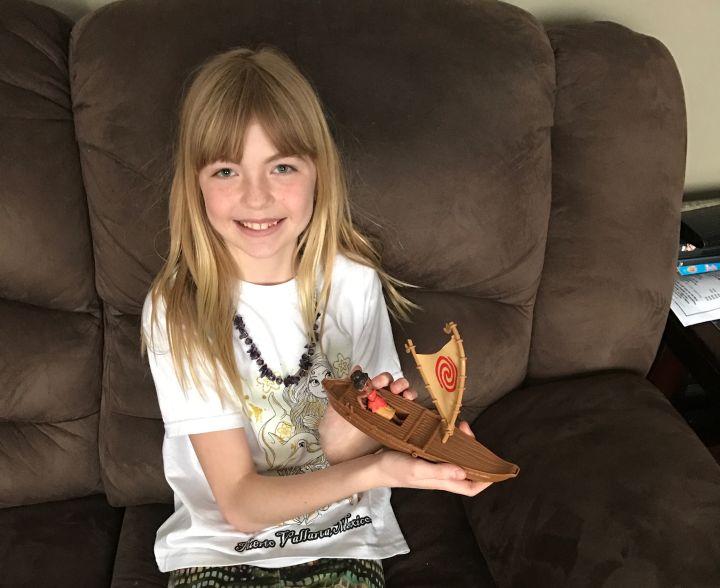 Rory with one of the toys she bought using the money inside the random act of kindness envelope.