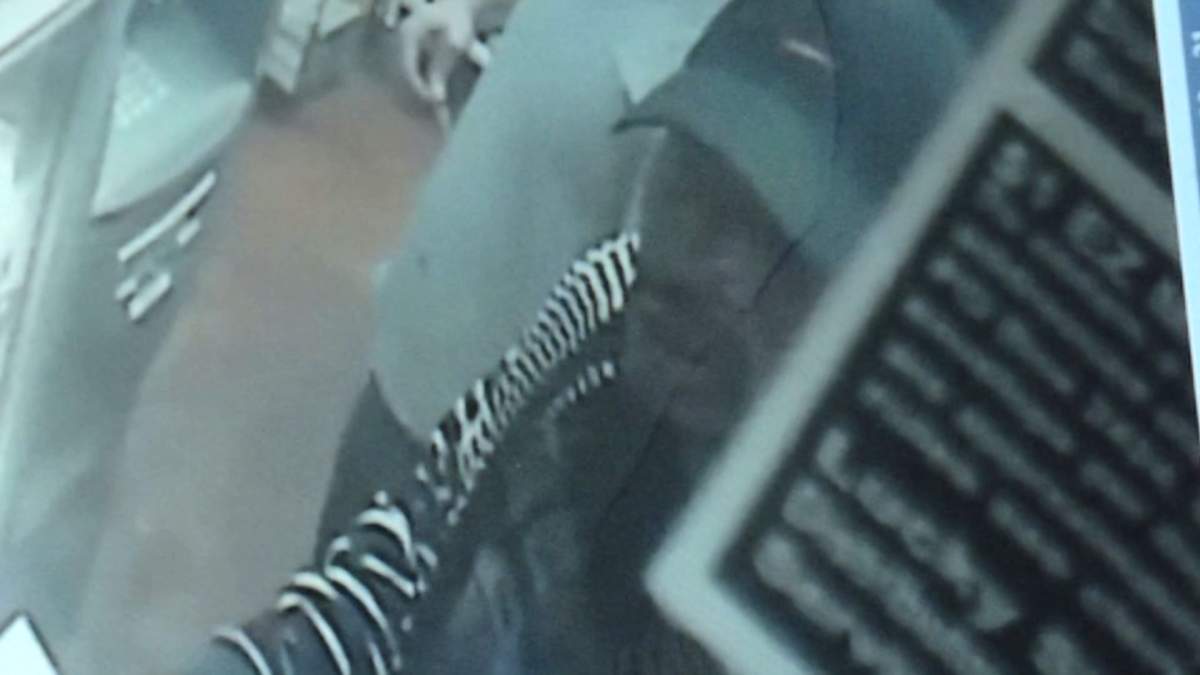 Surveillance video captures the image of a man suspected of kidnapping an Alabama woman at gunpoint and putting her in the trunk of a car.