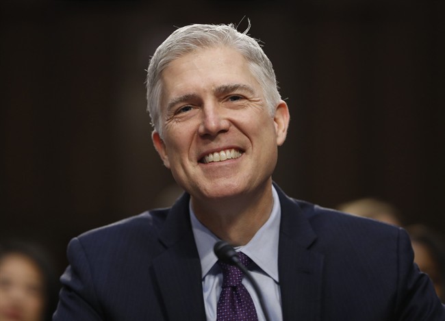 In this March 21, 2017 photo, Supreme Court Justice nominee Neil Gorsuch smiles on Capitol Hill in Washington, during his confirmation hearing before the Senate Judiciary Committee. (AP Photo/Pablo Martinez Monsivais).