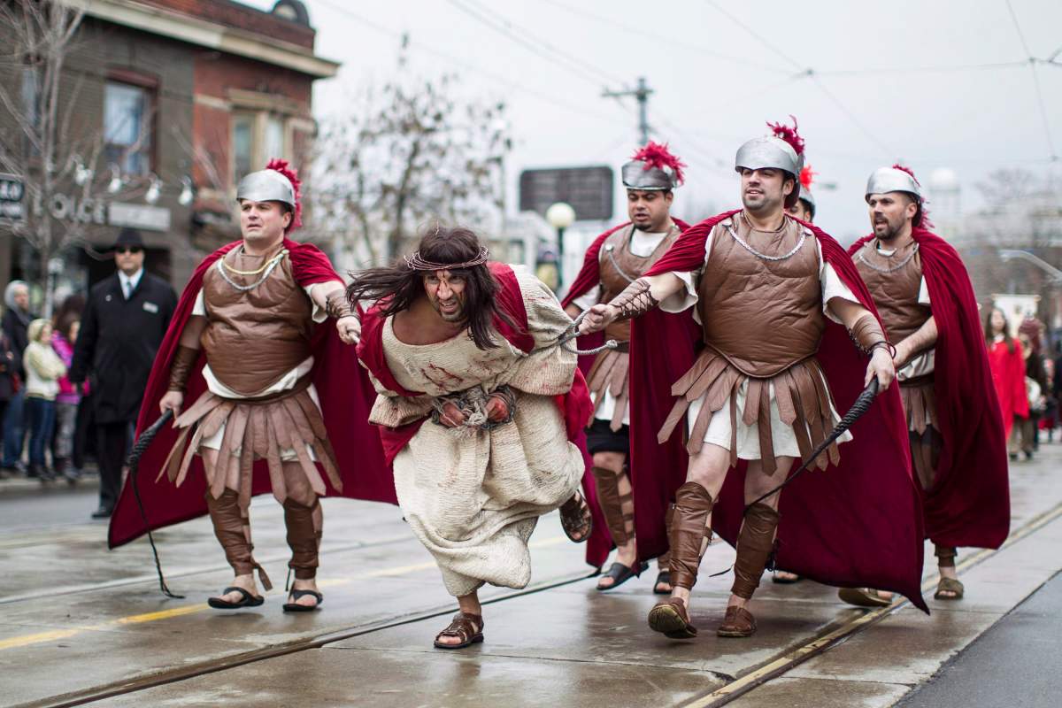 Fabio Gesufatto is led through the streets as he portrays Jesus during the Good Friday procession in Little Italy in April 2014. Streetcar diversions will happen Friday afternoon on College Street and Dundas Street West.
