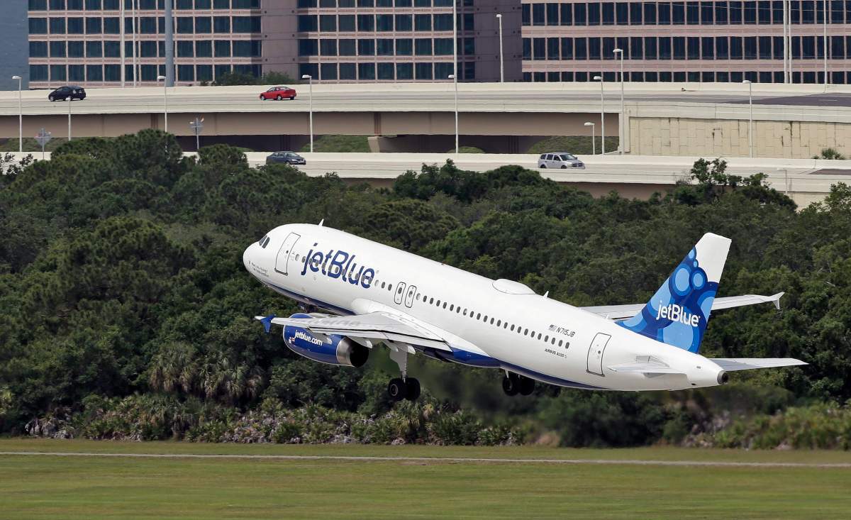 In this Thursday, May 15, 2014, file photo, a JetBlue Airways Airbus A320-232 takes off from the Tampa International Airport in Tampa, Fla. JetBlue reports financial results Tuesday, July 26, 2016.