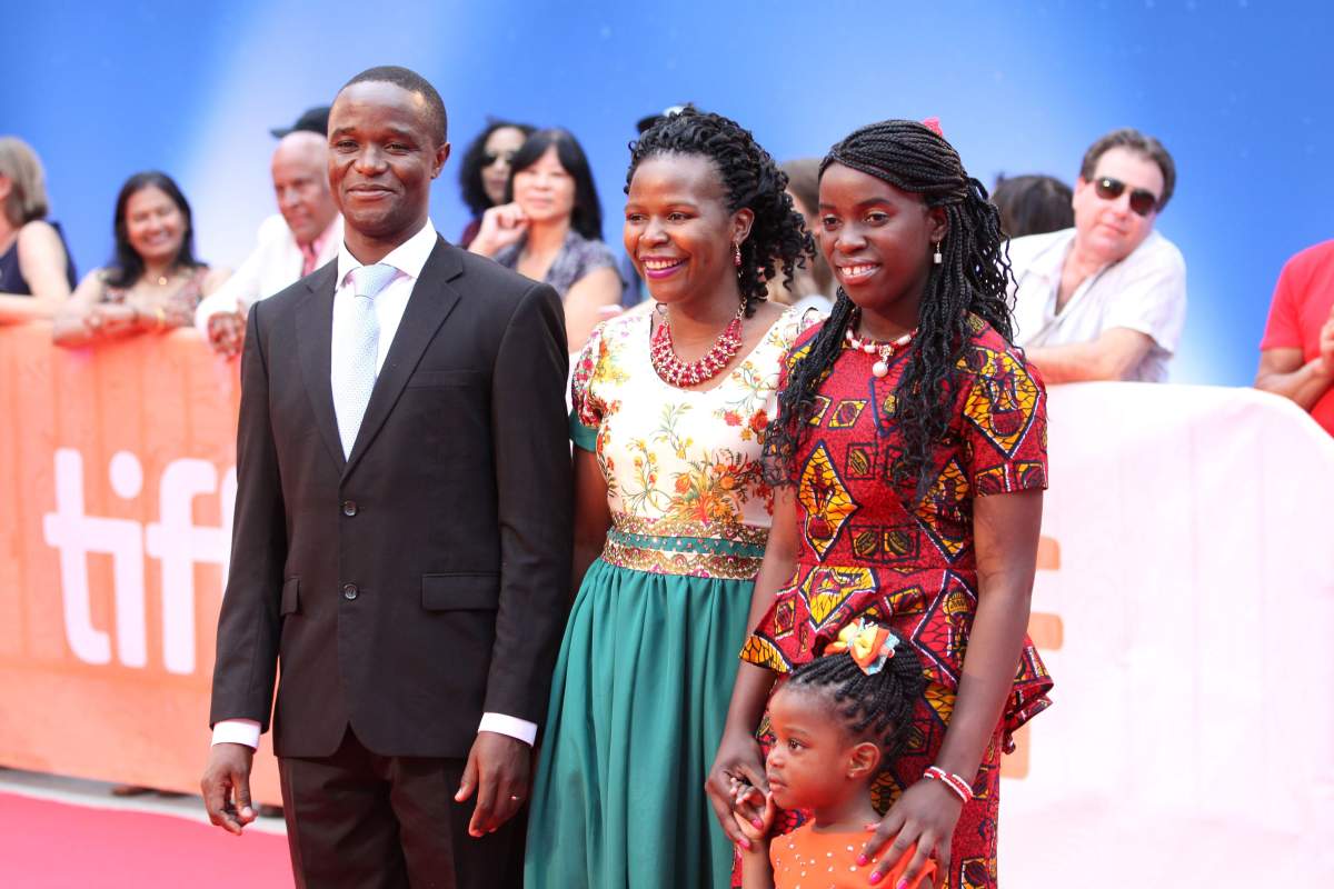 Robert Katende, Phiona Mutesi and her family at the “Queen of Katwe” premiere at the Toronto International Film Festival on Sept. 10, 2016.