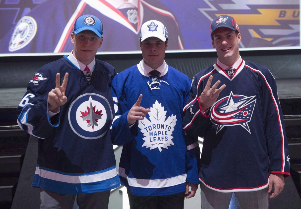 The NHL top three draft picks, Patrik Laine, of the Winnipeg Jets, left to right, Auston Matthews, of the Toronto Maple Leafs and Pierre-Luc Dubois, of the Columbus Blue Jackets, pose for a photo at the NHL draft in Buffalo, N.Y. on Friday June 24, 2016. Teammates were struck by how cool Matthews remained during a 13-game goal drought at one point this season. The Winnipeg Jets saw something similar in Laine when things went sideways.THE CANADIAN PRESS/Nathan Denette.
