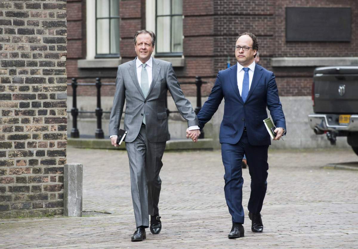 Negotiators Alexander Pechtold (L), leader of the Democrats D66 party, and Wouter Koolmees, financial specialist of D66, hold hands as they arrive for a talk between relevant political parties, The People’s Party for Freedom and Democracy (VVD), Christian Democratic Appeal (CDA), Democrats 66 (D66) and the Green Left Party (GroenLinks), in The Hague, The Netherlands, on April 3, 2017. They participated in an act of solidarity for two gay men who were physical abused after holding hands in public in Arnhem, on April 1, 2017.
