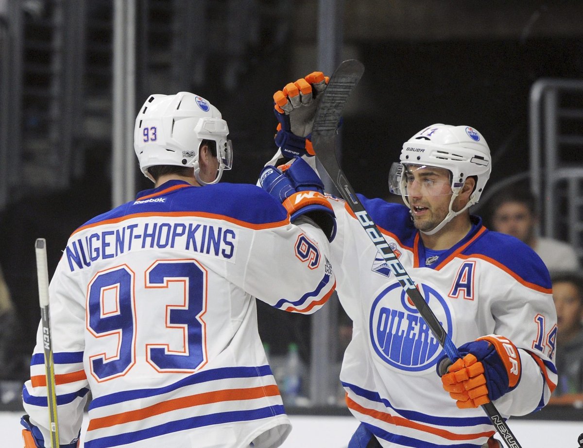 Edmonton Oilers center Ryan Nugent-Hopkins and right wing Jordan Eberle (14) celebrate a' first-period goal during an NHL hockey game, Tuesday, April 4, 2017, in Los Angeles.