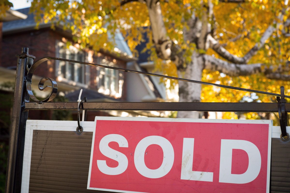 A sold sign hangs in front of a west-end Toronto property. Toronto home prices continue to rise at a breakneck pace, as policy-makers contemplate options aimed at cooling the country's hottest housing market.