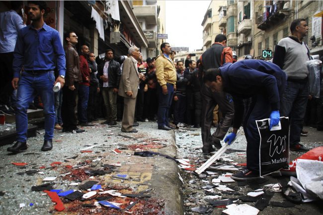 People clean up debris after the explosion at Saint Mark\’s Cathedral in the coastal city of Alexandria, the historic seat of Christendom in Egypt, Sunday April 9 2017.