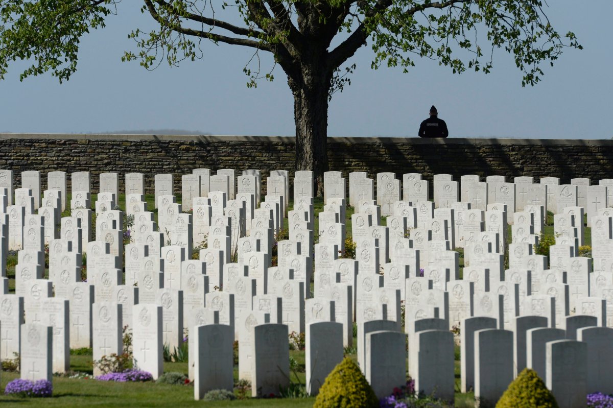 A French police officer stands guard at a Cabaret-Rouge cemetery near Vimy Ridge Sunday, April 9, 2017 near Arras, France. THE CANADIAN PRESS/Adrian Wyld.