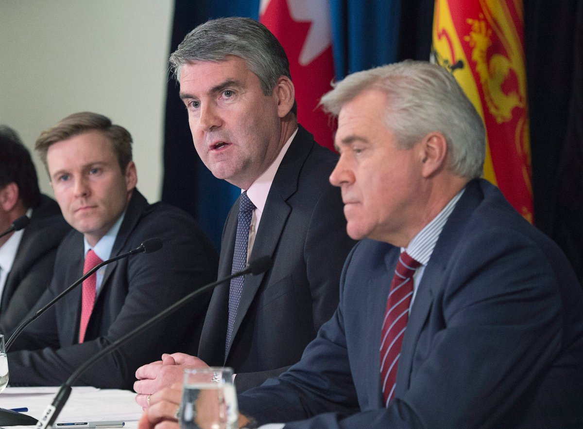Nova Scotia Premier Stephen McNeil fields a question as New Brunswick Premier Brian Gallant, left, and Newfoundland and Labrador Premier Dwight Ball, right, look on at a meeting of Atlantic premiers in Saint John, N.B. on Wednesday, April 12, 2017. Prince Edward Island Premier Wade MacLauchlan was not at the event but participated by telephone. 