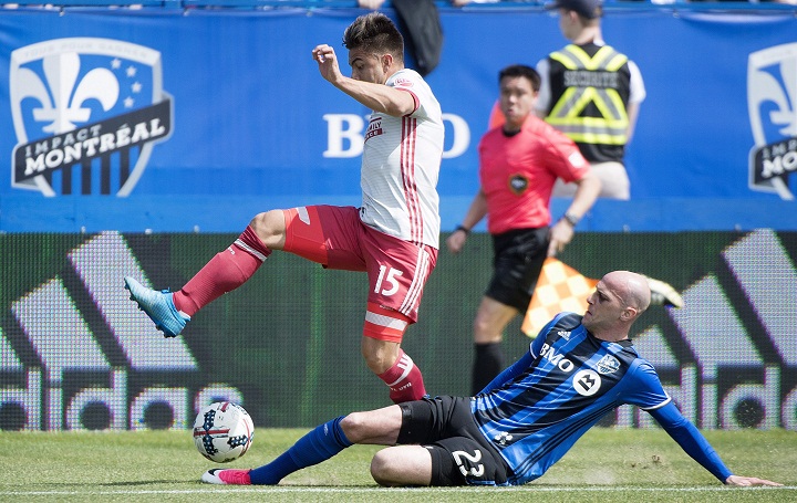 Montreal Impact's Laurent Ciman, right, challanges Atlanta United's Hector Villalba during first half MLS soccer action in Montreal, Saturday, April 15, 2017. THE CANADIAN PRESS/Graham Hughes