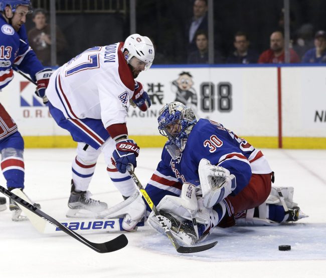Montreal Canadiens' Alexander Radulov, left, scores a goal past New York Rangers goalie Henrik Lundqvist during the third period in Game 3 of an NHL hockey first-round playoff series, April 16, 2017, in New York. 