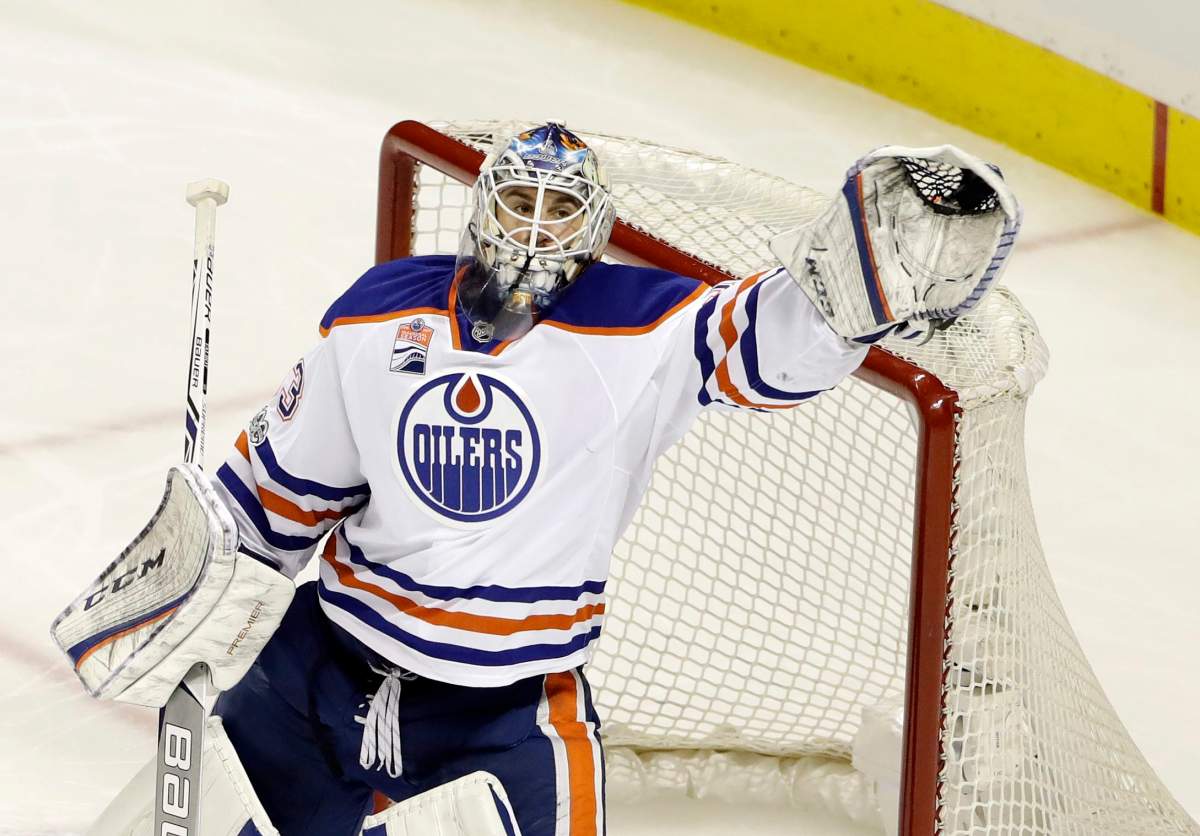 Edmonton Oilers goalie Cam Talbot stops a shot against the San Jose Sharks during the third period in Game 3 of a first-round NHL hockey playoff series Sunday, April 16, 2017, in San Jose, Calif. (AP Photo/Marcio Jose Sanchez).
