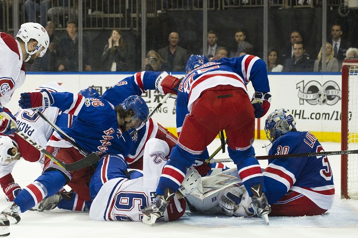 New York Rangers goalie Henrik Lundqvist (30) has action in front of his goal from Montreal Canadiens left wing Artturi Lehkonen (62), New York Rangers right wing Mats Zuccarello (36) and New York Rangers defenseman Brady Skjei (76) during game four of the first round of The Eastern Conference Playoffs between The New York Rangers and The Montreal Canadiens at Madison Square Garden in Manhattan, New York. Tuesday, April 18, 2017.