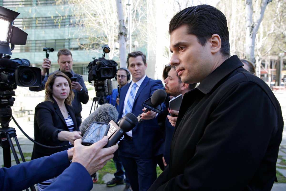 Igor Litvak, right, the attorney for Russian hacker Roman Seleznev, talks to reporters, Friday, April 21, 2017, in Seattle, following the federal court sentencing of Seleznev to 27 years in prison after he was convicted of hacking into U.S. businesses to steal credit card data. 