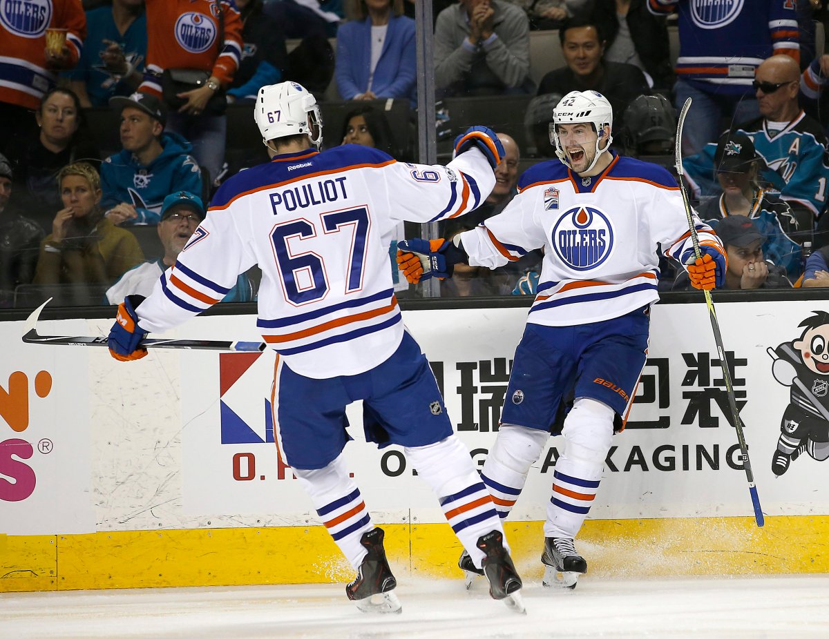 Edmonton Oilers left wing Anton Slepyshev (42) celebrates after scoring a goal with teammate Benoit Pouliot (67) during the second period against the San Jose Sharks in Game 6 of a first-round NHL hockey playoff series Saturday, April 22, 2017, in San Jose, Calif. (AP Photo/Tony Avelar).