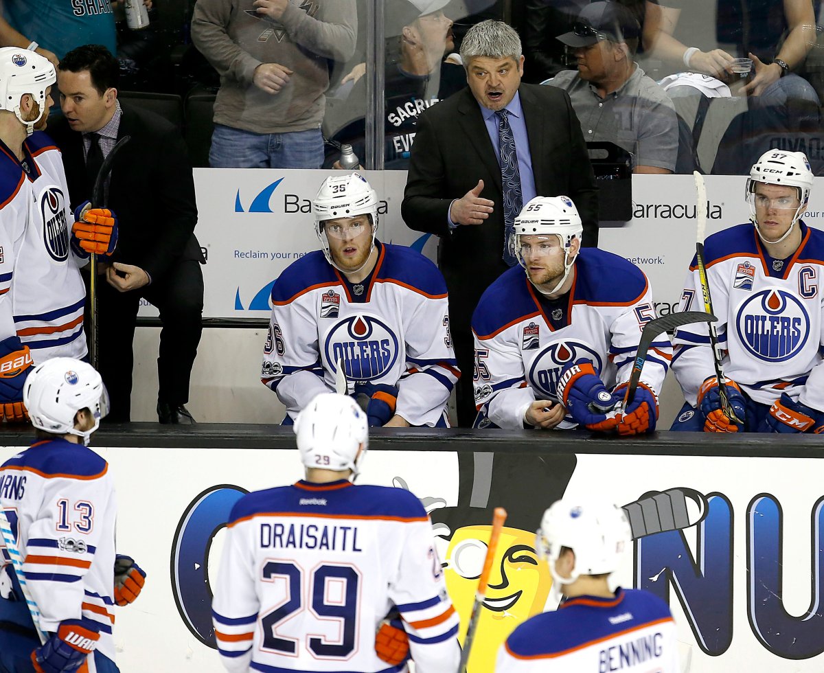 Edmonton Oilers head coach Todd McLellan, center, talks with his players during a time-out against the San Jose Sharks in the third period in Game 6 of a first-round NHL hockey playoff series Saturday, April 22, 2017, in San Jose, Calif. The Oilers won 3-1. (AP Photo/Tony Avelar).