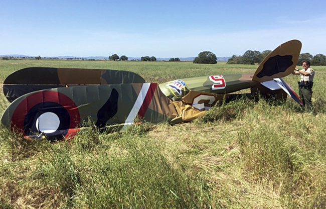 This photo provided by the San Luis Obispo County Sheriff's Department shows the wreckage of replica World War I-era biplane that crashed in a field near Paso Robles, Calif., on California's central coast Sunday, April 23, 2017.