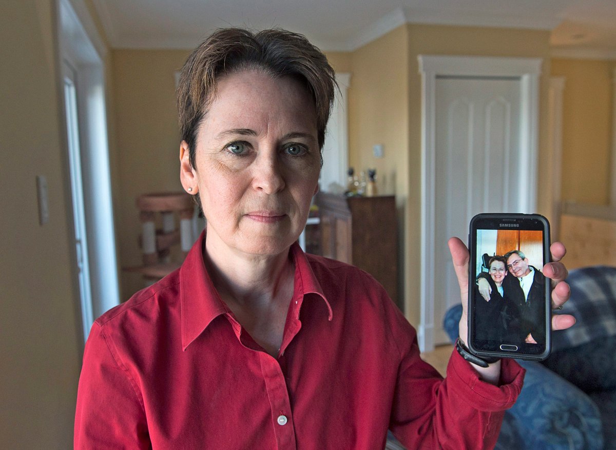 Kim D'Arcy displays an image of her late husband Jack Webb at her home in Bedford, N.S. on Thursday, April 13, 2017. Webb died after being diagnosed with pancreatic cancer but not before enduring a difficult ordeal with a health care system that is grappling with the pressures of overcapacity.