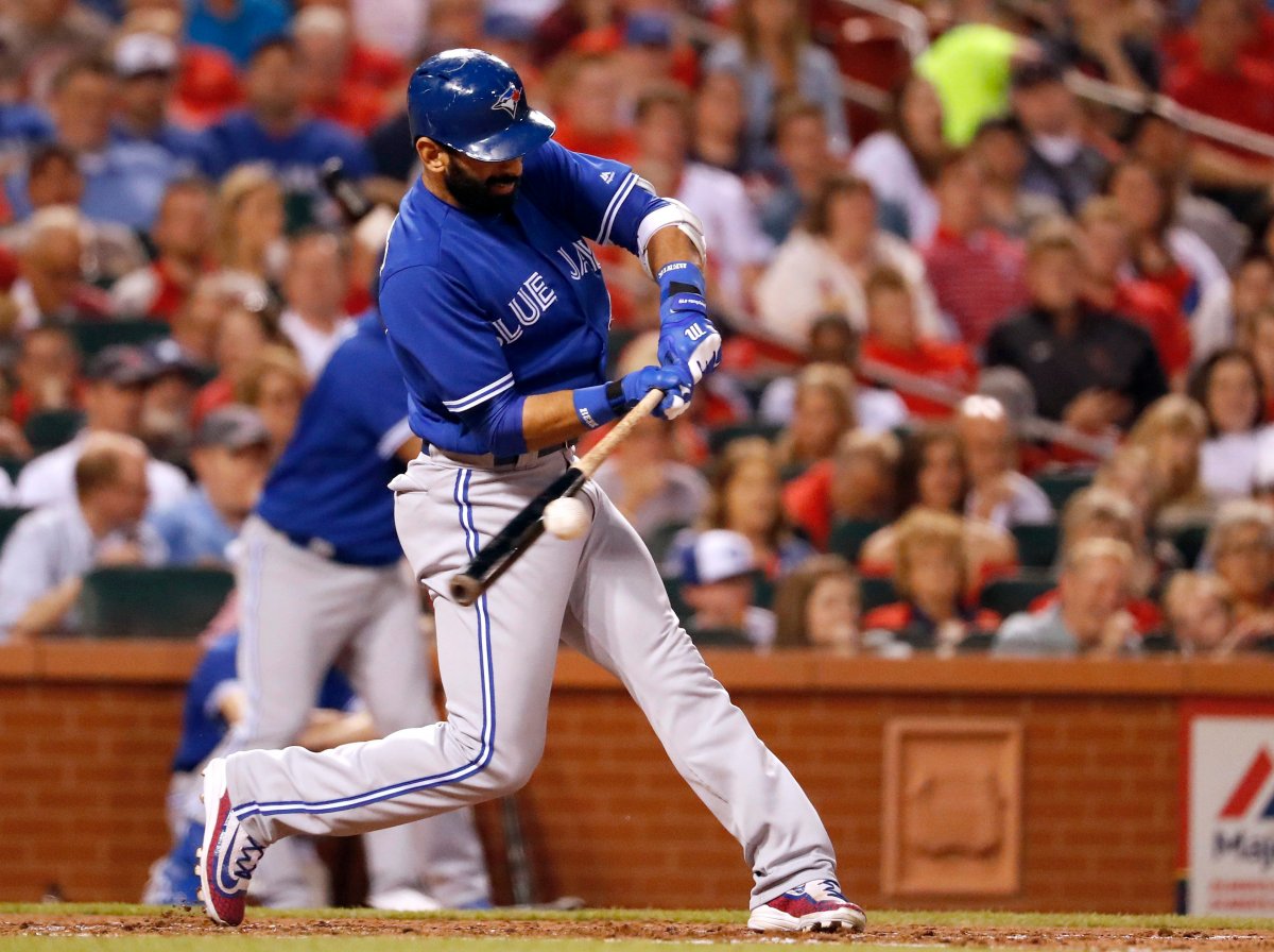 Toronto Blue Jays' Jose Bautista singles during the fourth inning of a baseball game against the St. Louis Cardinals.