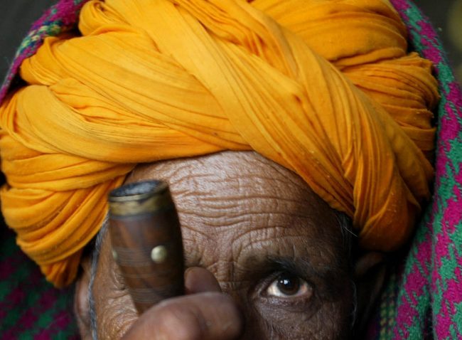 A villager puffs a chillum in the holy town of Pushkar in the northern Indian state of Rajasthan, Nov. 1, 2016.