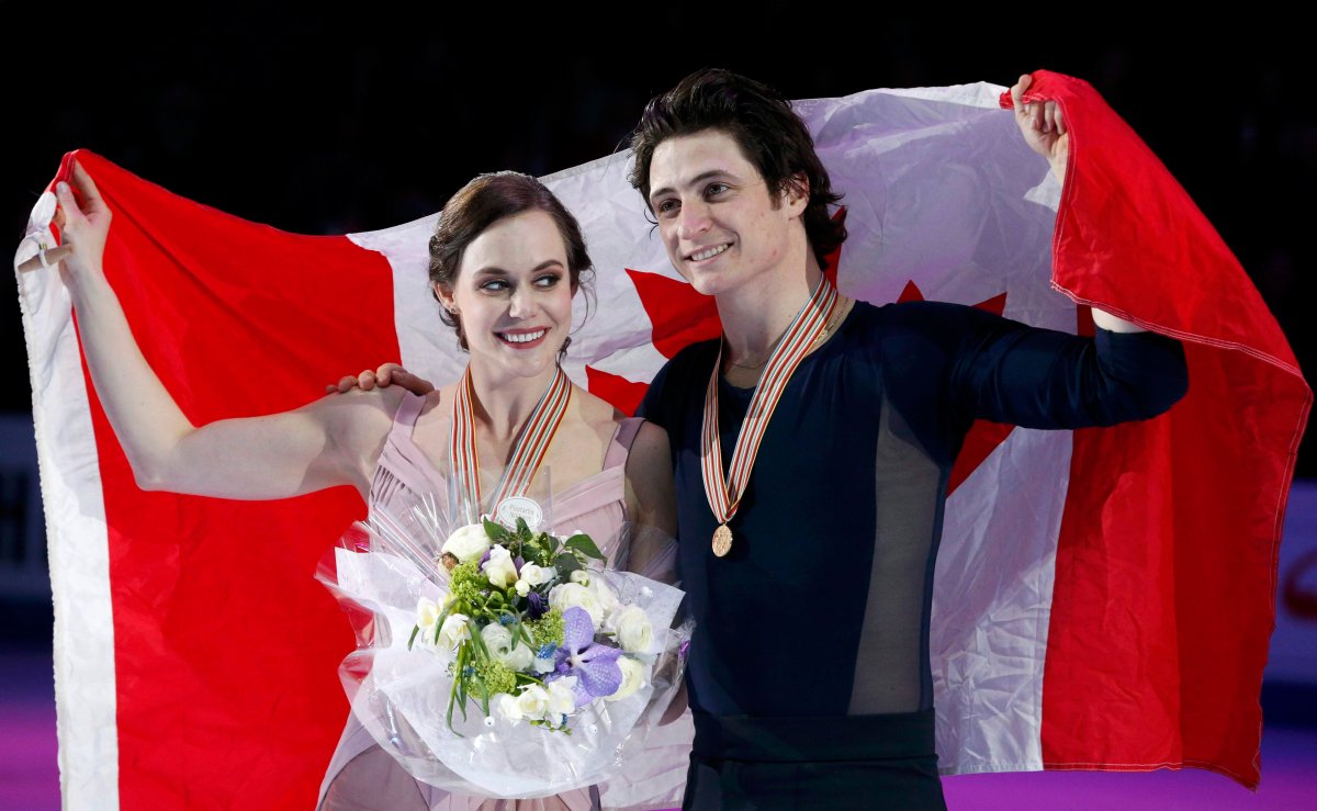 Gold medallists Tessa Virtue and Scott Moir of Canada attend the ceremony. 
